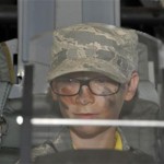 A Jr. Raptor sits inside of an aircraft’s cockpit April 12 at Tyndall’s Hangar 5. The Jr. Raptor program allows military children to experience what their parents would go through for a deployment. (U.S. Air Force photo by Airman 1st Class Solomon Cook)