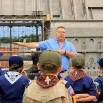 Jim Wolf, Landing Craft Air Cushion (LCAC) Fleet Support Representative at Naval Surface Warfare Center Panama City Division (NSWC PCD), explains various capabilities of the hovercraft to Cub Scout Pack 323 onboard LCAC 66 June 1, 2015 in Panama City, Florida. (RELEASED) (Photo by Katherine Mapp, NSWC PCD)